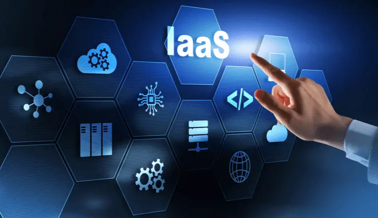 Image of a human hand pointing at the letters IaaS. Image includes pictures of a cloud and other IT related items